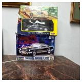 Assorted Model Car Kits and Die-Cast Cars
