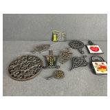Lot of Cast Iron Trivets and Sign