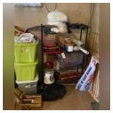 CORNER LOT TO INCLUDE BLACK METAL WIRE SHELF WITH CONTENTS, TOTE OF CHRISTMAS DECOR, ASSORTED BOOKS, BEDDING IN PLASTIC, CLAY VASES, ETC