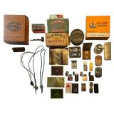 ASSORTMENT OF VINTAGE LIGHTERS TO INCLUDE ZIPPO, MARLBORO, CAMEL, CHESSIE, FIREBIRD, MIKASA, M.T.C, PHARAOH’S GOLD, AND MORE; 2 CAMEL SNUS TINS; OTHER VINTAGE CAMEL TIN; MARLBORO KEYCHAIN; WOODEN CI