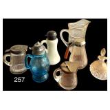 5 VINTAGE TO ANTIQUE SYRUP PITCHERS TO INCLUDE 1 MILK GLASS, 1 VICTORIAN COIN DOT BLUE FOOTED GLASS SYRUP PITCHER, 3 OTHERS; GLASS CRUET W/ LID; GLASS JUICE PITCHER