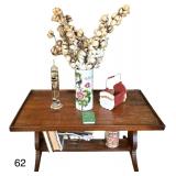 WOODEN COFFEE TABLE AS-IS W/ CONTENTS TO INCLUDE GALILEO THERMOMETER, ORIENTAL JARDINIERE, SMALL CHRISTMAS BASKET, GIDEON NEW TESTAMENT, VINTAGE NECO TIN, BRASS RACK, ETC.