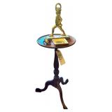 SHAMBURGER’S RICHMOND VA MAHOGANY ROUND TABLE/PLANT STAND W/ VINTAGE BRASS SOLDIER DOORSTOP, BRASS ACORN ORNAMENT, EARTHENWARE GOLD COLOR SQUARE TRAY