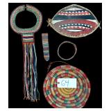 TRIBAL ITEMS: MAASAI BEADED NECKLACE, MAASAI SHIELD, MAASAI EAR FLAP, BEADED NECKBAND, WOVEN COILED BASKET