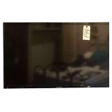 HISENSE 40” TELEVISION W/ WALL MOUNT - BUYER RESPONSIBLE FOR REMOVAL - W/ SONY DVD PLAYER AND SMALL ASSORTMENT OF DVD