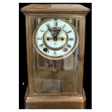 VINTAGE ANSONIA CLOCK W/ PORCELAIN FACE IN BRASS AND GLASS CASE W/ KEY