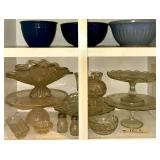 VINTAGE BLUE WATT MIXING BOWL, SMALL APPEARS TO BE FIESTA MIXING BOWL, OTHER BLUE MIXING BOWL, CLEAR GLASS CAKE PLATES, SALT AND PEPPER SHAKERS, BUTTER DISH, FOSTORIA AMERICAN BOWL, ETC.