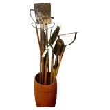 WOODEN BARREL W/ ASSORTMENT OF YARD TOOLS: SQUARE SHOVEL, SPADE SHOVEL, RAKE, HAY FORK, ETC.