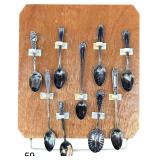 EIGHT VINTAGE TO ANTIQUE SILVER SPOONS TO INCLUDE WILLIAM ROGERS, ONEIDA, AND WALLINGFORD