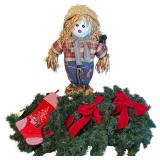 THREE WREATHS WITH RED BOWS, VELVET STOCKING, AND SCARECROW