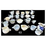 LARGE LOT OF CREAM PITCHERS (SOME AS-FOUND) TO INCLUDE KNOWLES, RUDOLF ZIBELL ESKILSTUNA, HOMER LAUGHLIN, GREEN LETTER JAPAN, YELLOW GLASS PEAR PATTERN, USA POTTERY, SHENANGO CHINA USA, BUFFALO CHINA 