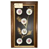 FRAMED BOARD W/ 6 SMALL FLORAL PLATES APPLIED