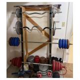 FOUR BARBELLS WITH WEIGHTS, ADDITIONAL WEIGHTS (SOME STEEL, SOME PLASTIC), KETTLE BELLS, MEDICINE BALL AND ABDOMINAL EXERCISERS