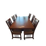 WOODEN MISSION STYLE DINING TABLE APPROX. 84” X 42” W/ 6 MATCHING CHAIRS ON ROLLERS