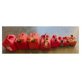 8 GAS CANS OF ASSORTED SIZES
