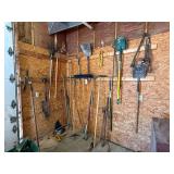 LARGE LOT OF GARDENING TOOLS TO INCLUDE SHOVELS, PICKS, HOSE, SLEDGEHAMMER, BROOMS, RAKES