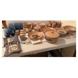 PFALTZGRAFF STONEWARE FOLK ART DISHES: COFFEE MUGS, 2 QUART CASSEROLE, CHIP AND DIP, EIGHT SAUCERS, SEVEN DESSERT PLATES, ONE HEART SHAPED PLATE, ONE CALENDAR, ONE SHELL PIPE PLATE, CREAM AND SUGAR, N