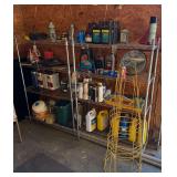 PAIR OF FOUR SHELF STAINLESS STEEL SHELVES WITH CONTENTS TO INCLUDE TIRE SEALANT, DUST PANS, THERMOMETER, OIL COOLANT AND TOMATO CAGES