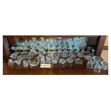 APPROX. 39 CLEAR GLASS CANDLEHOLDERS TO INCLUDE PRESSED GLASS, PATTERN GLASS, AND OTHERS
