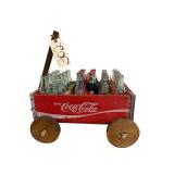 VINTAGE COCA-COLA WOODEN CRATE WAGON W/ ASSORTMENT OF GLASS COCA-COLA BOTTLES TO INCLUDE 17 UNIV. TENNESSEE WOMEN’S BASKETBALL