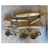 COLLECTION OF ANTIQUE PRIMITIVE WOODEN AND WROUGHT IRON FARM IMPLEMENTS, LIKELY FOR A HORSE OR OX HARNESS, INCLUDING SINGLE TREES (SWINGLETREES) AND VARIOUS PULLEYS