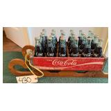 24 BOTTLED COKES IN OLD VINTAGE COKE TRAY ON SLED