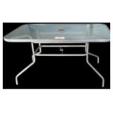OUTDOOR GLASS TOP PATIO TABLE APPROXIMATELY 36” WIDE X 56” LONG X 28” TALL
