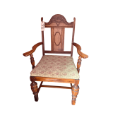 ANTIQUE ENGLISH REVIVAL DINING ARM CHAIR FEATURING CARVED WOOD DETAILS AND JACOBEAN-INSPIRED STYLE ELEMENTS