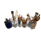 LARGE ASSORTMENT OF PAINTBRUSHES OF VARYING SIZES IN GLASS CONTAINERS TO INCLUDE 1 COBALT BLUE