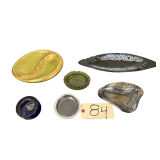 DISTRESSED GREEN CARVED-LOOK ROUND DISH, MID-CENTURY STYLE ASHTRAY, SMALL GREEN PRESSED GLASS DISH, CLEAR HEART-SHAPED GLASS ASHTRAY, COBALT BLUE GLASS ASHTRAY, AND SMALL CLEAR GLASS DISH