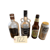 KRAKEN GLASS RUM BOTTLE, LA COLOMBE GLASS RUM BOTTLE, VINYL LAGER GLASS BEER BOTTLE, ALUMINUM LIQUID DEATH WATER CAN (GLASS BOTTLES EMPTY)