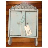 SMALL 2-DOOR WALL CABINET WITH CARVED TOP; APPEARS TO BE VINTAGE