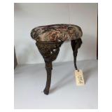 ANTIQUE ROUND TAPESTRY STOOL WITH 3 METAL CHERUB-STYLE LEGS, APPROX. 14" DIAMETER