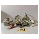 ASSORTED ITEMS TO INCLUDE 2 PORCELAIN LIDDED BOXES, CUPS AND SAUCERS—1 WITH BRASS HOLDER, MINIATURE VASE, SINGLE CHEF SHAKER, ART DECO SHOE, AND GOLD-TONE HANDLED BASKET; SOME WITH ORIENTAL THEME, S