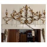 VINTAGE GOLD-TONE METAL HANGING ELECTRIC WALL SCONCE WITH 7 CANDLE LIGHTS AND 13 GLASS PRISMS, OVER 30" WIDE; 2 BRASS-TONE FURNITURE MOUNTS, APPROX. 10" TALL