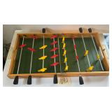 VINTAGE WOODEN FOLDING FOOSBALL TABLE, APPROX. 31" WHEN OPEN; 1 BLACK PLASTIC HANDLE MISSING