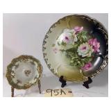 LARGE HAND-PAINTED FLORAL PLATE, 12" DIAMETER, AND FOOTED BOWL WITH GOLD TRIM, MARKED “N IN WREATH”