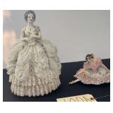 VINTAGE FEMALE FIGURES: LARGER FIGURE, APPROX. 11" TALL, AN ORIGINAL BY HEIRLOOMS OF TOMORROW, USA; SMALLER BALLERINA FIGURINE MARKED DRESDEN, GERMANY; BOTH WITH DAMAGE AROUND BASES; SMALL METAL SWING