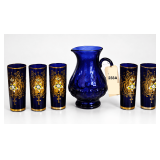 COBALT BLUE GLASS PITCHER WITH 5 TALL, HEAVILY ENAMELED, GOLD-TRIMMED TUMBLERS