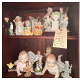 LOT TO INCLUDE LARGE PORCELAIN DOLL/BABY FIGURES, BRIDE-AND-GROOM DOLLS, TRINKET BOX, VICTORIAN-STYLE FIGURINES, ETC.; FROM 2 SHELVES IN SIDE SECRETARY IN ROOM BEHIND KITCHEN