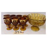 SET OF 7 STEMMED AMBER GLASSES WITH WIDE GOLD-BAND RIMS AND FOOTED AMBER GLASS COMPOTE