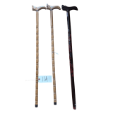 SET OF 3 VINTAGE CANES: 2 OAK CANES WITH CARVED HANDLES AND 1 DARK-FINISH CANE WITH CARVED HANDLE AND BASE