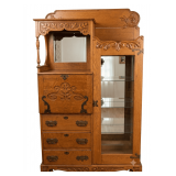 LARGE ANTIQUE OAK DROP-FRONT SECRETARY, APPROX. 6 FT. TALL, WITH CARVED DETAIL, BRASS HARDWARE, AND GLASS SHELVES IN RIGHT-HAND SECTION; CONTENTS NOT INCLUDED