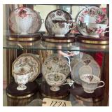 8 AVON “HONOR SOCIETY” CUPS AND SAUCERS WITH DISPLAY STANDS