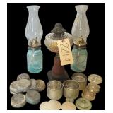 ANTIQUE OIL LAMP WITH METAL AND GLASS BASE; 2 BLUE BALL JARS CONVERTED TO OIL LAMPS; ASSORTED JAR TOPS/LIDS