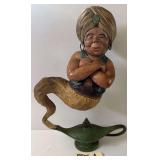 LARGE GENIE-EMERGING-FROM-LAMP FIGURE, APPROX. 18" TALL; APPEARS TO BE VINTAGE; MATERIAL APPEARS TO BE RUBBER OR COMPOSITE