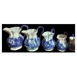 SET OF 5 GRADUATED-SIZE BLUE-AND-WHITE PITCHERS; FROM BOTTOM SHELF OF CHINA CABINET