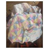 PLASTIC TOTE OF QUILTS; MOST APPEAR NEWER, TOP QUILT APPEARS TO BE VINTAGE AND HANDMADE