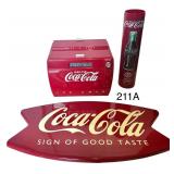 COCA-COLA LOT: METAL SIGN, COOLER-SHAPE PLASTIC RADIO, AND PLASTIC BAG DISPENSER WITH MISSING LID