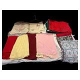 LARGE ASSORTMENT OF TABLECLOTHS AND TABLE RUNNERS: FLORAL, SOLID, WOVEN, REDS, GREENS, YELLOWS, ETC.